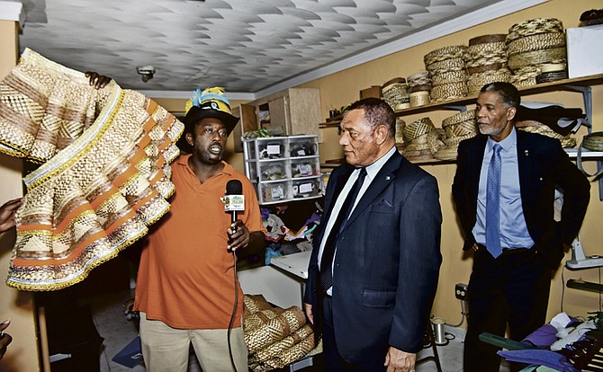 Prime Minister Perry Christie being shown carnival outfits. Photo: Kemuel Stubbs/BIS