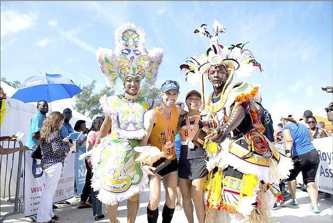 The 2016 Marathon Bahamas winners pose with Junkanoo dancers. 
Photo: Sunshine Insurance Race Weekend 
