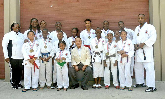 Students of the New Providence Martial Arts & Fitness Centre participated in the 49th Annual Japan Karate-Do Ryobu-Kai (JKR) International Tournament (April 29-May 1st, 2016) in Anaheim, California.  Pictured back row from left to right are: Sensei Chinyere T. A. Ijeoma, Chief Instructor New Providence Martial Arts & Fitness Centre Japan Karate-Do Ryobu-Kai (JKR); Dominic McFall, William Knowles, Duran Rolle, Robyn Evans, Casey Myles Scavella, Chernard Thompson, Chigozie Ijeoma Jr. and Instructor, Sensei Roland A Evans III. Pictured front row from left to right are: Miles Ferguson, Nkume Ijeoma, Aidan Rolle, Chianna Diggiss, Sensei Kiyoshi Yamazaki, 9th Dan JRK, Jadyn Munnings, Charles William Diggiss, Alexander Turner and Daryn Morgan Sands.
(Photo/ Bede Derek Sands)
