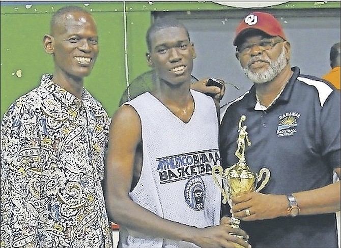 Dylan Musgrove (centre) was the most valuable player in the B Division of Bahamas Basketball Federation’s Annual BTC Bunny Levarity National Championships. Also shown is Dylan’s father, Gordon ‘Slanks’ Musgrove, and BBF President Charlie ‘Softly’ Robins.