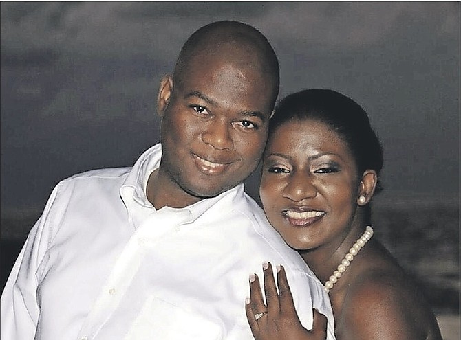 Angelo Black with his wife. The Commonwealth Bank employee begged people to tell her that he loved her as he lay injured with a gunshot wound to the neck after being kidnapped by a robber on Tuesday. Mr Black survived the attack and is in stable condition in hospital.