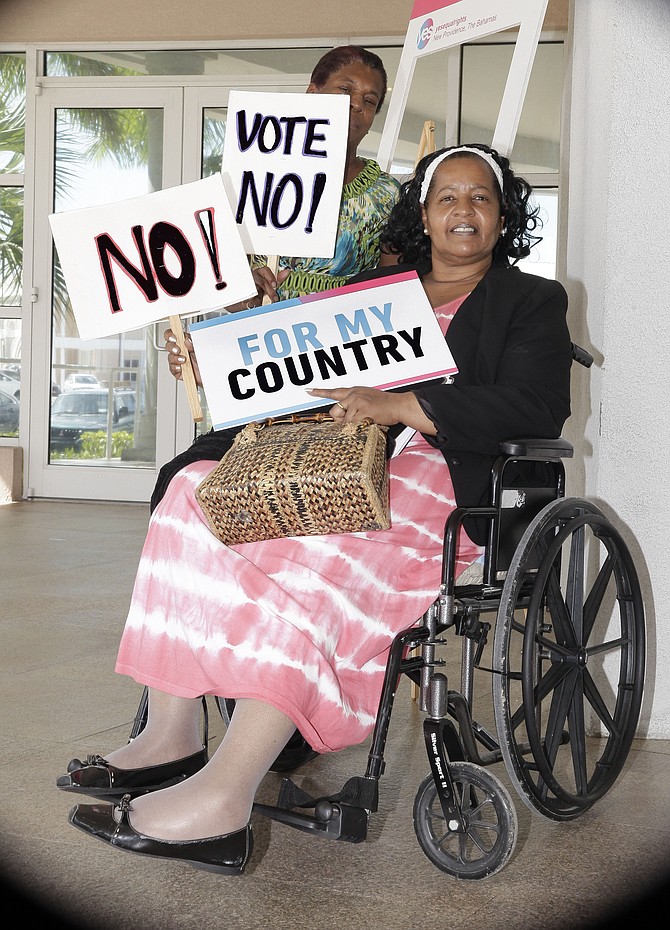 Phillippa ‘Lady’ Russell showing her opposition to the constitutional referendum during the launch of the ‘Yes’ campaign at the College of The Bahamas. She is pictured with her personal assistant, Sylvia Lynden. 