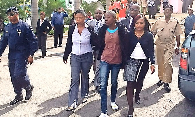 Raquel Johnson (brown shirt) outside of court.