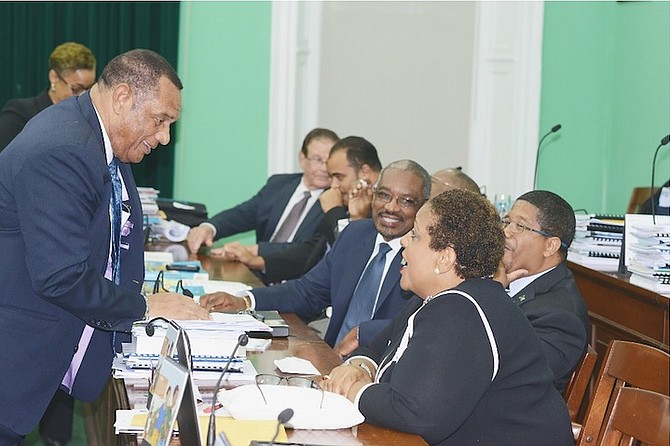 Prime Minister Perry Christie, FNM leader Hubert Minnis and Loretta Butler-Turner MP sharing a light-hearted moment in the House of Assembly last year. 