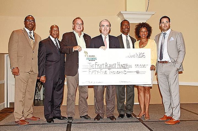 The Bahamas National Feeding Network donates $55,000 in food vouchers to over 100 network partners to help combat the increasing scourge og hunger in the Bahamas yesterday at the Melia Nassau Beach Resort.