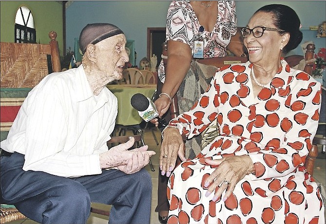 Governor General Dame Marguerite Pindling with 103-year-old Samuel Vincent Neily, of The Bluff, Eleuthera, at St Joseph’s Adult Day Care Centre. Photos: Tim Clarke/Tribune Staff