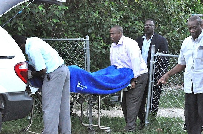 THE man's body is removed from the scene in the Pioneer’s Loop Subdivision of Freeport.
Photo: Vandyke Hepburn