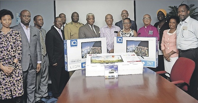 The presentation of three television sets to the Bahamas Department of Correctional Services yesterday. 