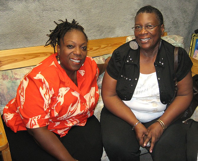 Patricia “Smiling Pat” Hoyte (in red blouse) with her mother, Mary Hoyte.
