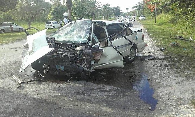 The extensively damaged Honda Accord which was involved in a head-on collision on Tonique Williams Darling Highway on Thursday morning