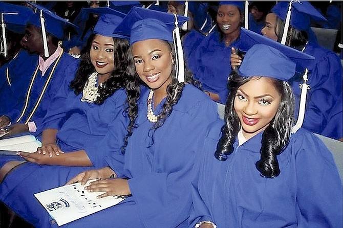 Graduates are all smiles in their caps and gowns. Photos: Shantique Longley
