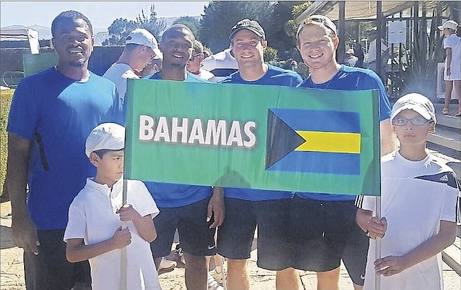 SHOWN (l-r) are Marvin Rolle, Kevin Major and Baker and Spencer Newman with the young flag carriers for the Bahamas in Bolivia.