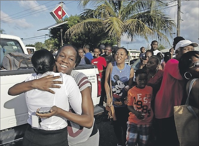 A Royal Bahamas Defence Force recruit embracing her loved one at the Golden Gates Shopping Plaza before entering training. Photo: Able Seaman Huden Johnson/RBDF
