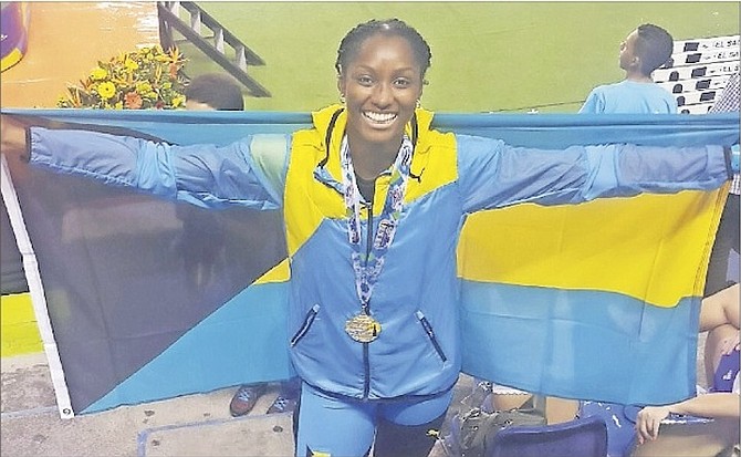 DANIELLE GIBSON celebrates her gold medal performance in the triple jump at the NACAC Under-23 Championships.
