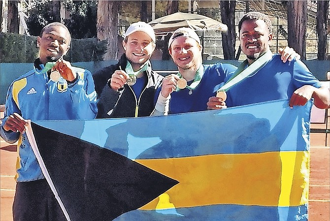 WELL DONE TEAM BAHAMAS: Shown (l-r) are Kevin Major Jr, Spencer and Baker Newman and Marvin Rolle proudly holding the national flag after their victory in Bolivia.