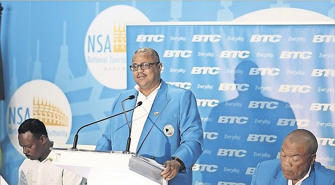 BAHAMAS Olympic Committee secretary general Romel Knowles (centre) releases the names of the 28 athletes who will represent the Bahamas at the Rio Olympics August 5-21. BOC President Wellington Miller (far right) and Minister of Youth, Sports & Culture Dr Daniel Johnson (left) look on during the press conference yesterday.
Photo by Shawn Hanna/Tribune Staff