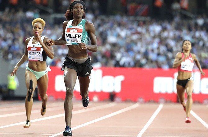 Shaunae Miller (centre) on her way to winning the women's 400 metre race during the Diamond League anniversary games at The Stadium, in the Queen Elizabeth Olympic Park in London, Friday. (AP Photo/Matt Dunham)