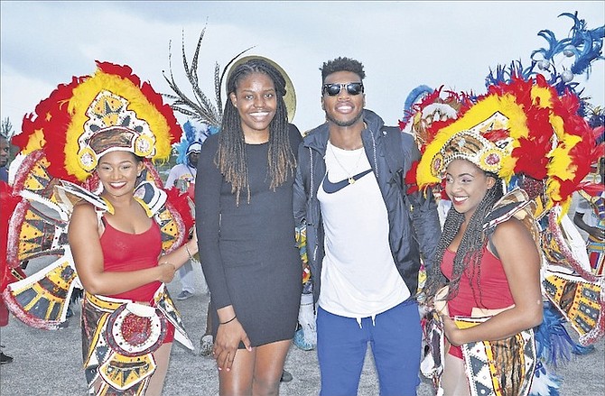 JONQUEL JONES and Buddy Hield are surrounded by junkanoo dancers during their welcome home over the weekend.
Photo by Vandyke Hepburn/BIS