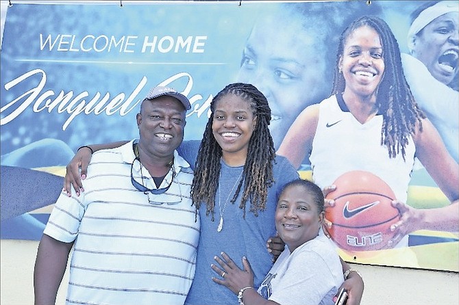 JONQUEL JONES with her parents Preston and Ettamae Jones on her arrival home Saturday at Grand Bahama International Airport. 
Photo by Mario Duncanson