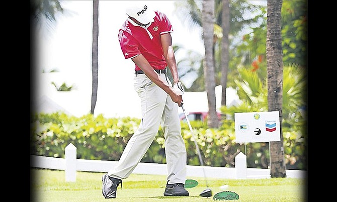 DeVaughan Robinson, of the Bahamas, drives on the second day of the Caribbean Amateur Golf Championship at the Ocean Club course, Paradise Island.   