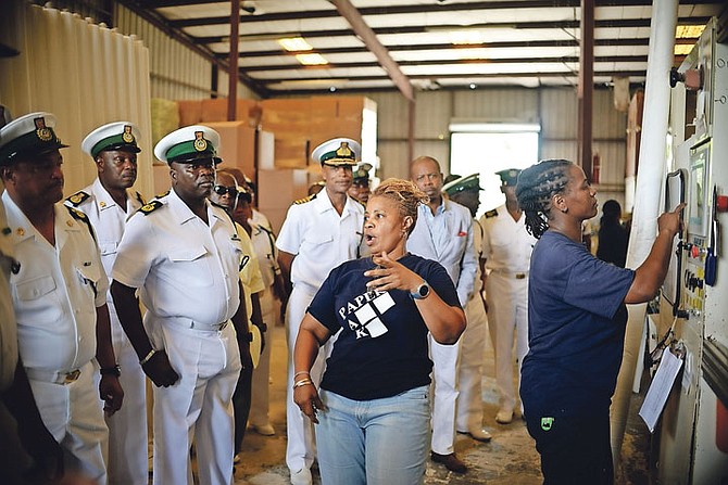 Royal Bahamas Defence Force Officers tour BAIC's Industrial Park. The officers are pictured in Bahamas Paper Converting Co. and being shown around by the owner, Sharon Winder. Photo Shawn Hanna