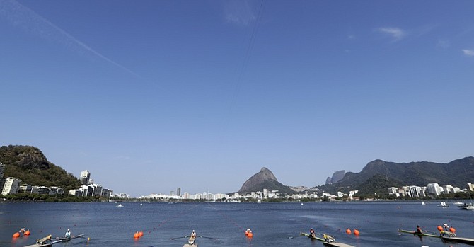 Rowers compete in the Women's single sculls heats in Lagoa. (AP)