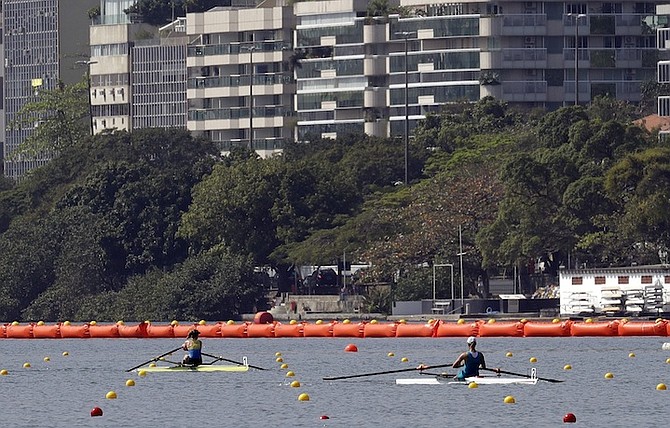 The Bahamas' Emily Morley and Svetlana Germanovich, of Kazakhstan, compete in the women's single sculls E/F semifinal heat in Rio de Janeiro on Tuesday. (AP)
