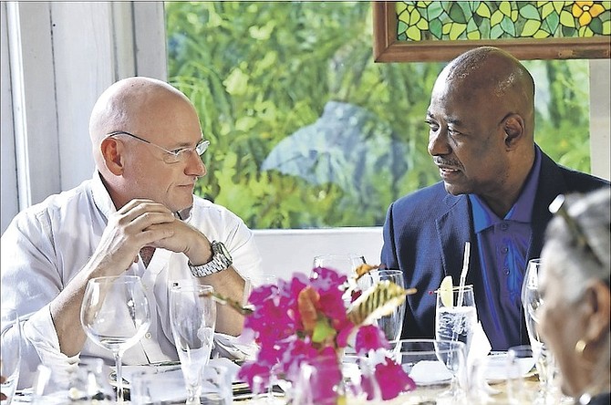 Astronaut Scott Kelly with tourism minister Obie Wilchcombe at Graycliff restaurant in Nassau on Sunday.