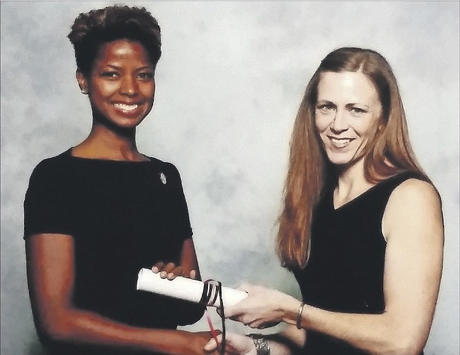 Dr DeVonnia Bonimy-Lee (left) receives her certification at the American Physical Therapy Association’s recognition ceremony in California in February this year. 