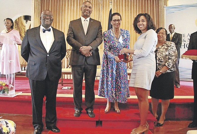 Simone Cambridge receiving her award for being this year’s All Bahamas Merit Scholar from Governor General Dame Marguerite Pindling. Photo: Tim Clarke/Tribune Staff