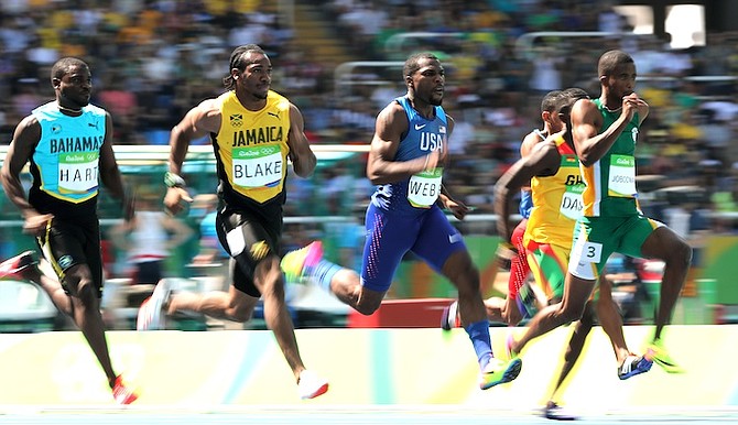 From left, Bahamas' Shavez Hart, Jamaica's Yohan Blake, United States' Ameer Webb, and South Africa's Anaso Jobodwana compete in a men's 200-metre heat. (AP)