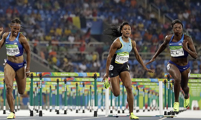 Pedrya Seymour (centre) in the 400m hurdles final. (AP)