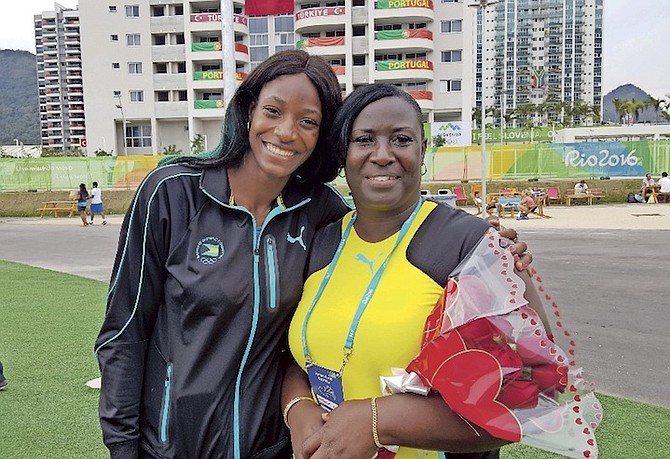 OLYMPIC GOLD MEDALLIST Shaunae Miller and her mother, Maybelene, share a special moment at the Rio Olympics.