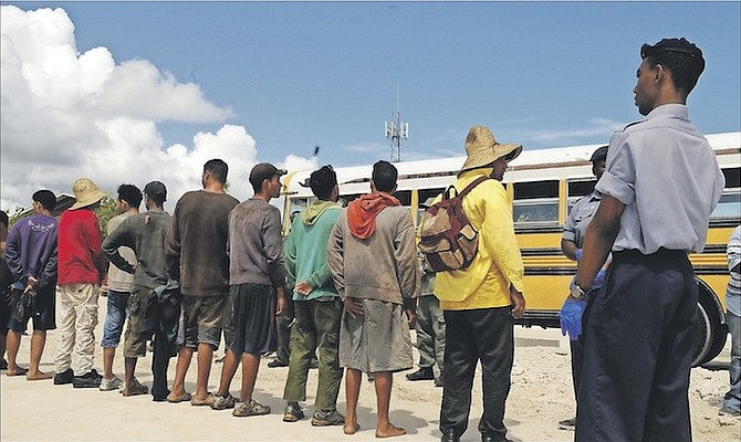 Some of the Cuban migrants detained earlier this year pictured waiting to be transported to the Carmichael Road Detention Centre. Photo: Petty Officer Jonathan Rolle/RBDF
