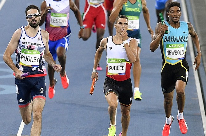 Stephen Newbold (right) runs in the 4x400m heat. (AP)