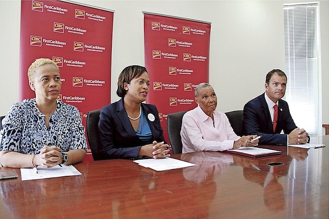 First Caribbean launches its fifth annual “Walk for the Cure” event yesterday. From left, Melissa Major, Marie Rodland-Allen, the managing director of CIBC First Caribbean, Andrea Sweeting, president of the Sister Sister support group and Trevor Torzsas, managing director customer relationship CIBS First Caribbean and co-chair of “Walk for the Cure”.