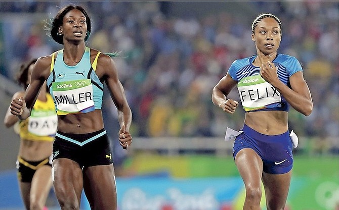 Shaunae Miller, left, of the Bahamas, and United States’ Allyson Felix compete in a 400-metre semi-final during the Summer Olympics at the Olympic stadium in Rio de Janeiro, Brazil, on Sunday, August 14. 
                                                                                                                                                                                                                          (AP Photo/David J Phillip)