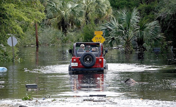 A man backs his Jeep up after trying to pass though floodwaters from Hurricane Hermine on Friday in Steinhatchee, Florida. (AP)