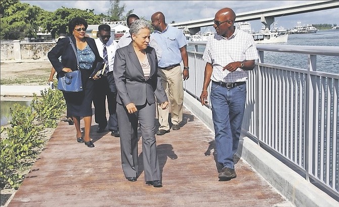 Minister of Transport and Aviation Glenys Hanna Martin walks on the newly-constructed boardwalk at the entrance to Potter’s Cay Dock, accompanied by Permanent Secretary at the Ministry, Lorraine Armbrister and stakeholders attached to the project. Photos: Patrick Hanna/BIS
