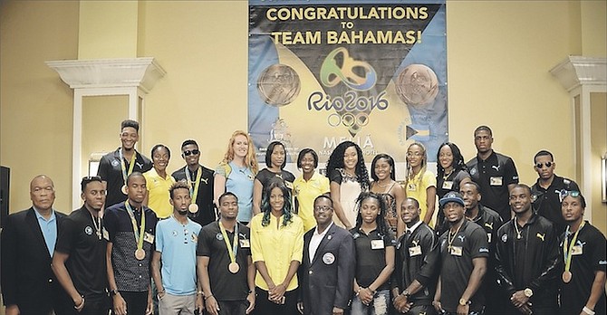 TEAM BAHAMAS members yesterday with Bahamas Olympic Committee President Wellington Miller (far left) and Minister of Youth, Sports and Culture Dr Daniel Johnson (centre front, during the victory celebration and award ceremony for the athletes’ performance in the 2016 Rio Olympics.