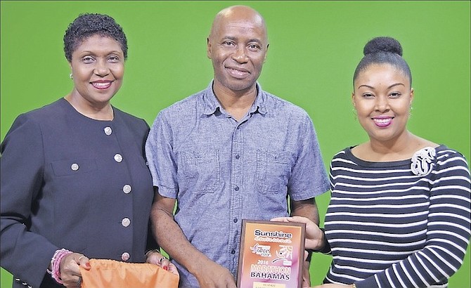 HONORARY Chair of the Susan G Komen Bahamas Race for the Cure Willie Moss (left) with TheBahamasWeekly.com Webmaster/Administrator David Mackey and Sunshine Insurance Race Weekend Marketing Co-ordinator and PR Chair Rogan Smith. 
