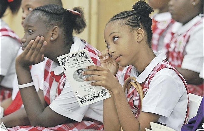 A tear from a student yesterday as students at Sadie Curtis Primary School attended a memorial for Marisha Bowen at C W Saunders school auditorium. Photo: Tim Clarke/Tribune Staff