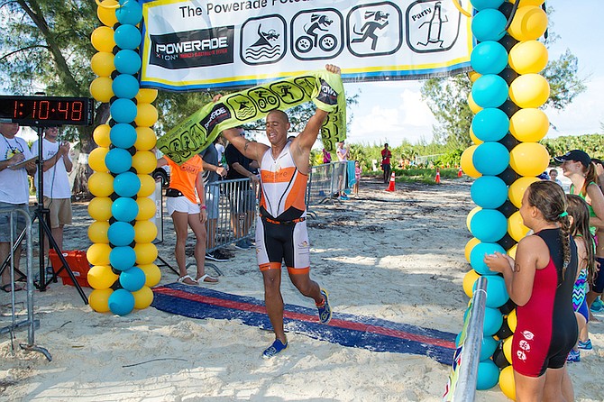 Cameron Roach wins the men's sprint event at the Powerade Potcakeman Triathlon at Jaws Beach on Saturday. Photo: Bahamas Visual Services