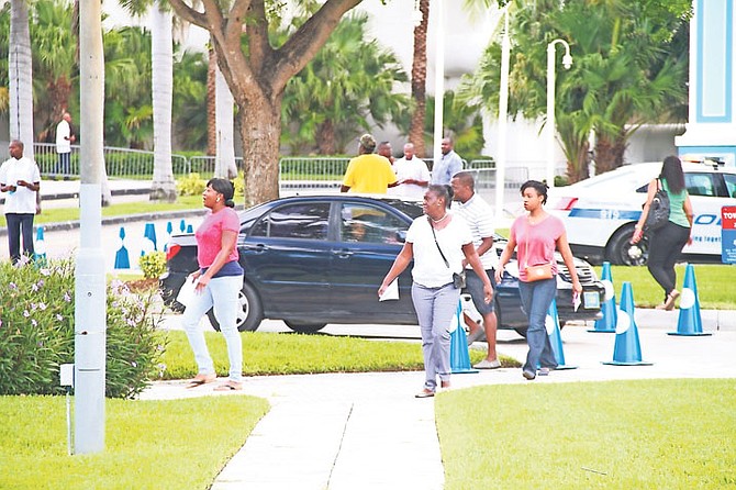 The scene at Baha Mar yesterday as former workers arrived to collect salary they were owed.