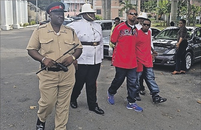 Patrickedo Rose (centre, left), and Rashad Sullivan (right), outside court. Photo: Lamech Johnson/Tribune Staff
