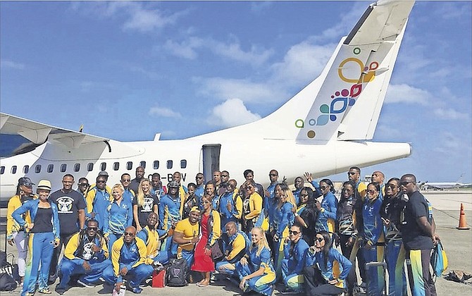 Officials and team members for the Bahamas bodybuilding team pose above outside of the chartered Bahamasair flight that took the team to Santo Domingo, Dominican Repulbic, for the 2016 CAC Bodybuilding and Fitness Championships this weekend.