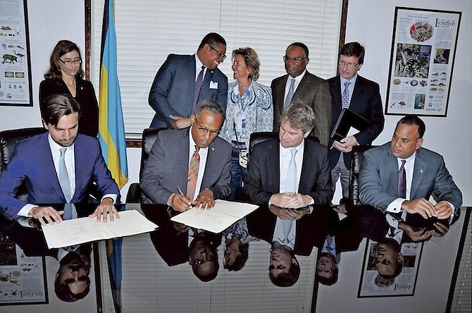 A tripartite Memorandum of Understanding (MOU) between the Ministry of Finance, the Inter-American Investment Corporation (IIC) which is the private sector arm of the IDB and the Grand Bahama Port Authority was signed on Thursday, September 29, 2016 at the Ministry for Grand Bahama. Shown standing from left are Florencia Attademo-Hirt, IDB’s representative in The Bahamas; Jerry Butler, Caribbean executive director, Inter-American Development Bank; Sarah St George, vice-chairman, Grand Bahama Port Authority; Melvin Seymour, permanent secretary, Ministry for Grand Bahama; and Graham Torode, chief executive officer, The Grand Bahama Development Company (DEVCO). Seated from left are: Henry St George, vice-president, Grand Bahama Port Authority; Dr Michael Darville, Minister for Grand Bahama; James Scriven, general manager, Inter-American Investment Corporation (IIC); and Michael Halkitis, chairman of the IDB and IIC and Bahamas Minister of State for Finance. Photo: Vandyke Hepburn/BIS