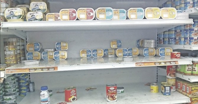 Sparse shelves in a supermarket yesterday, after a rush for products ahead of the storm.
Photo: Kenva Hunter