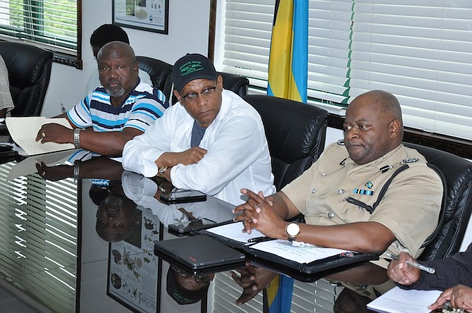 Dr Michael Darville, Minister for Grand Bahama (centre), at the emergency management meeting after which evacuation orders were issued for the island. Photo: Vandyke Hepburn/BIS