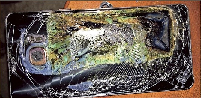 A damaged Samsung Galaxy Note 7 on a table after it caught fire. Samsung has discontinued production of the smartphones permanently (AP)